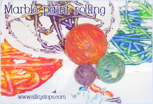 Marble paint rolling activity - children's mark making craft