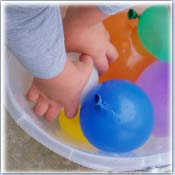 A bucket of water balloons ready to roll ..