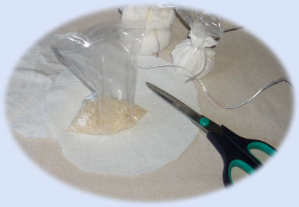 Explore loose media - fill circles of fabric and watch how they respond when used as paint splatts ..
