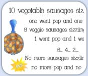 10 vegetable sausages sizzling in a pan