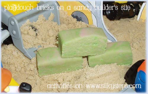Cut bricks of playdough and introduce wall building to a sand tray filled with diggers lorries and construction workers