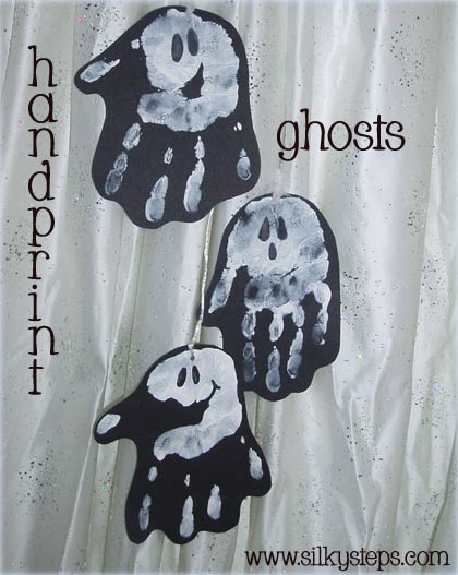 handpaint white ghosts onto black paper